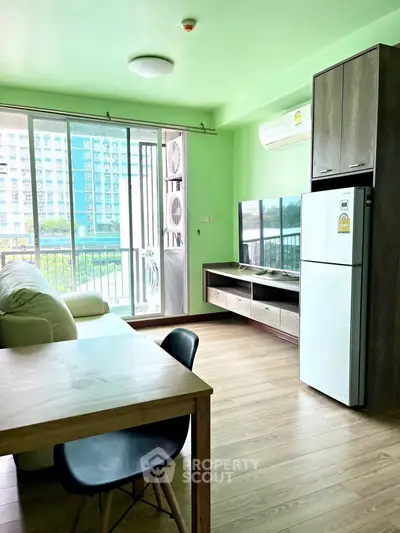Bright living room with modern furniture and large windows in a stylish apartment.