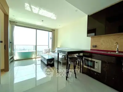 Modern living room with open kitchen and stunning balcony view