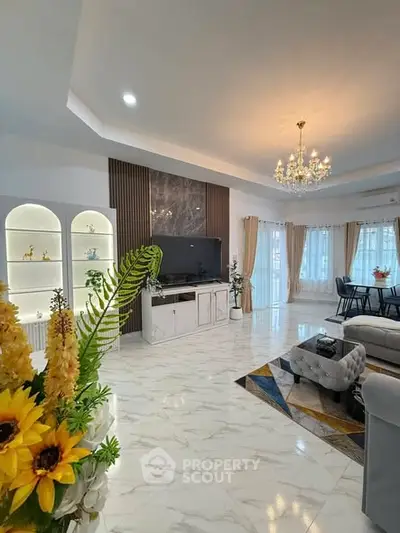 Luxurious living room with elegant chandelier and modern decor