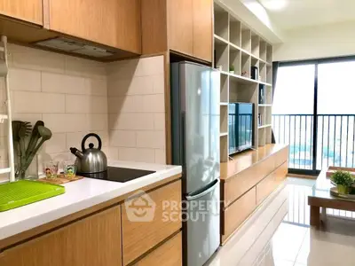 Modern kitchen with sleek appliances and open layout in stylish apartment