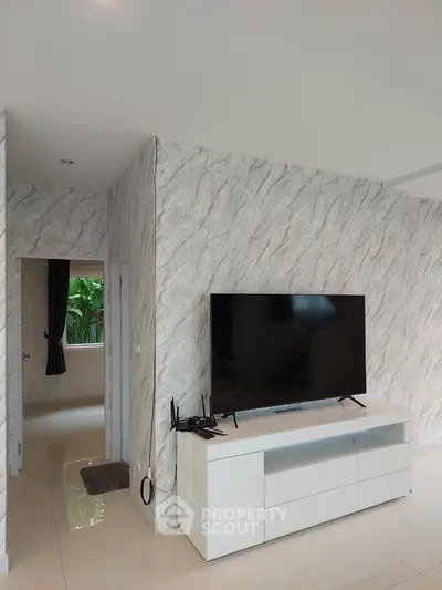 Modern living room with sleek TV setup and stylish decor