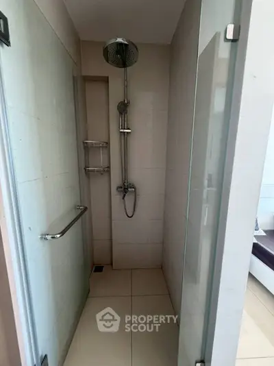 Modern minimalist bathroom with sleek shower design and glass door