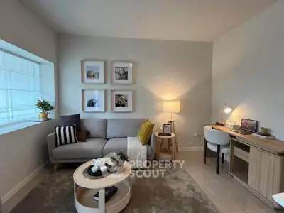 Modern living room with cozy sofa, stylish decor, and a compact study area, perfect for urban living.