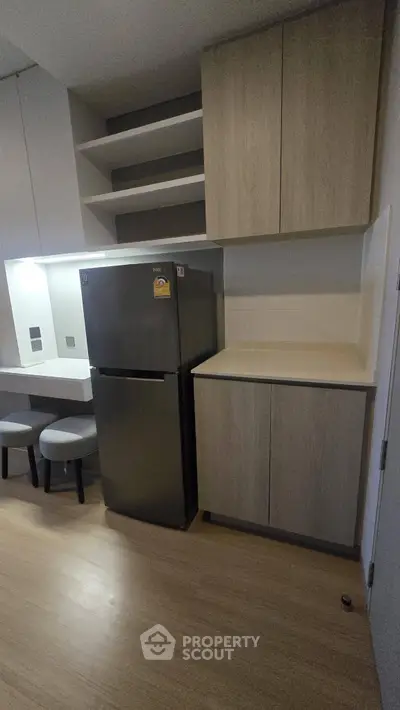 Modern kitchen with sleek cabinets and stainless steel fridge