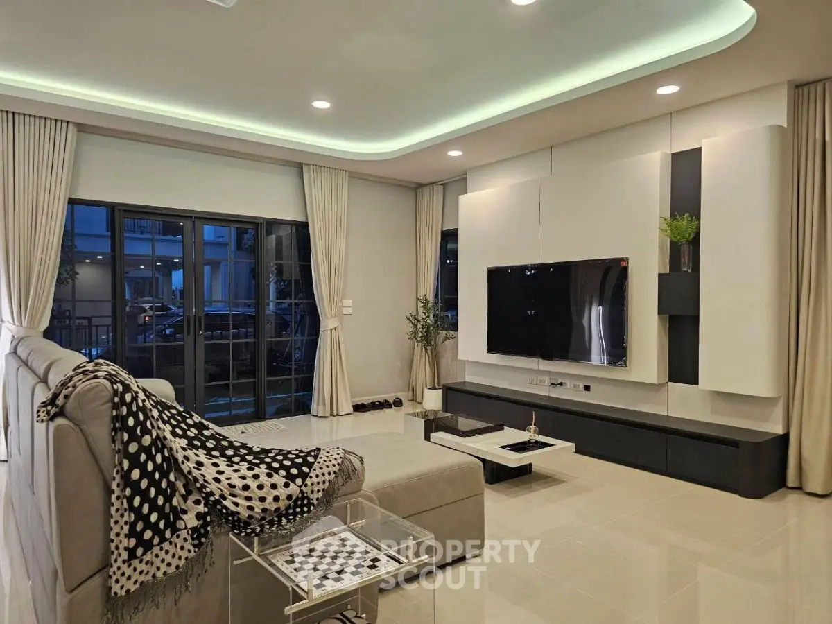 Spacious modern living room with sleek design and large windows