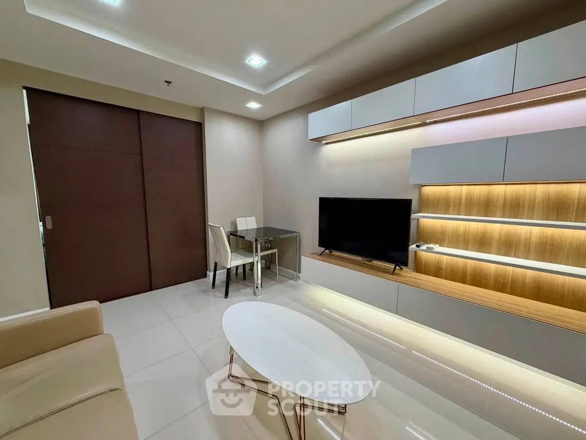 Modern living room with sleek furniture and built-in TV unit