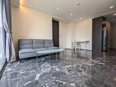 Spacious modern living room with marble flooring and sleek furniture