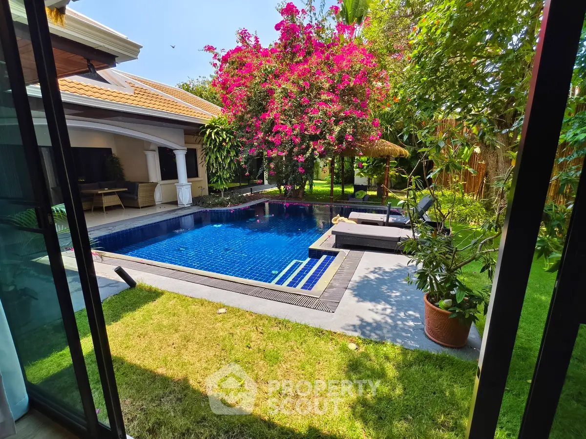 Luxurious villa with private pool and lush garden, perfect for relaxation and entertaining.
