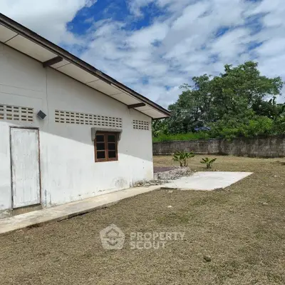 Charming rural property with spacious yard and lush greenery, perfect for tranquil living.
