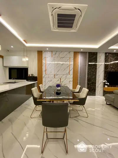 Luxurious modern dining room with marble accents and elegant lighting