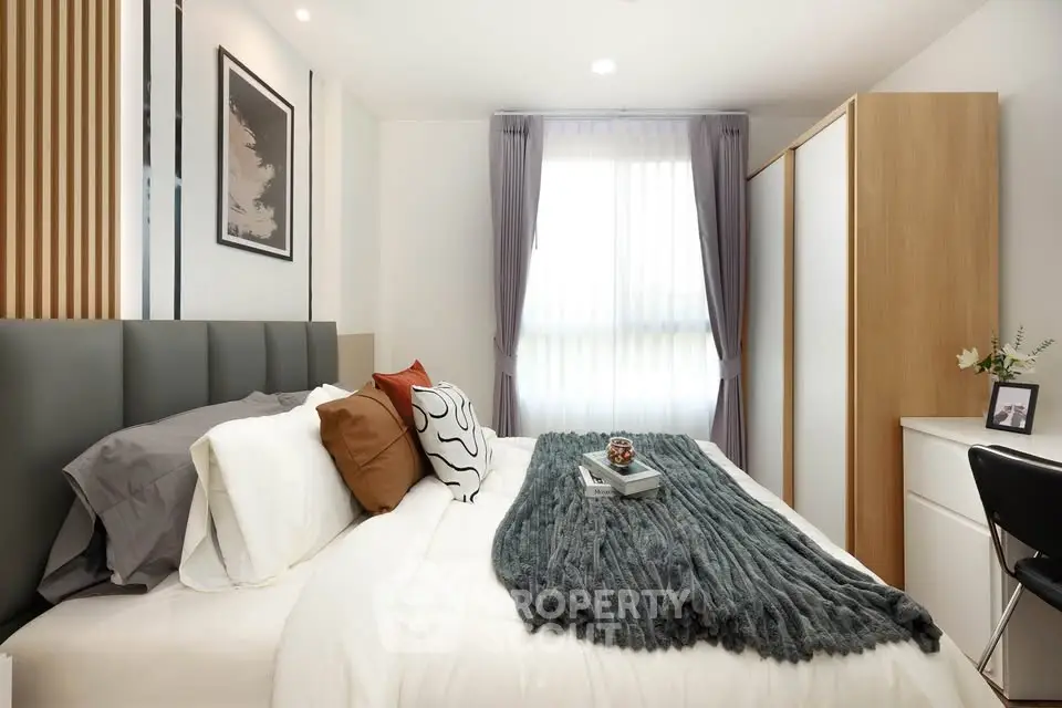 Stylish modern bedroom with cozy bedding and natural light