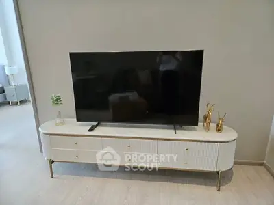 Modern living room with stylish TV stand and decor accents