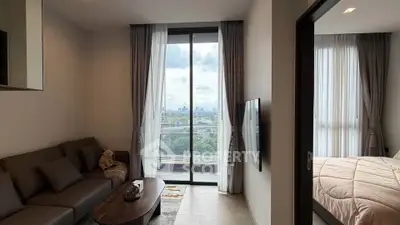 Modern living room with balcony view and adjacent bedroom in stylish apartment