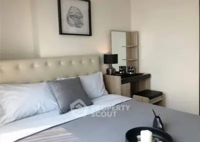 Modern bedroom with stylish decor and natural light