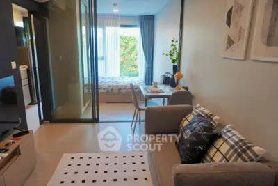 Modern studio apartment with open layout, cozy living area, and stylish decor.