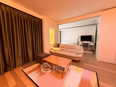Spacious living room with modern decor and cozy seating area
