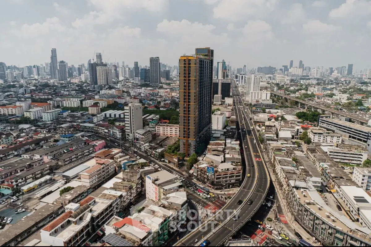 Stunning aerial view of urban skyline with high-rise buildings and bustling city streets.