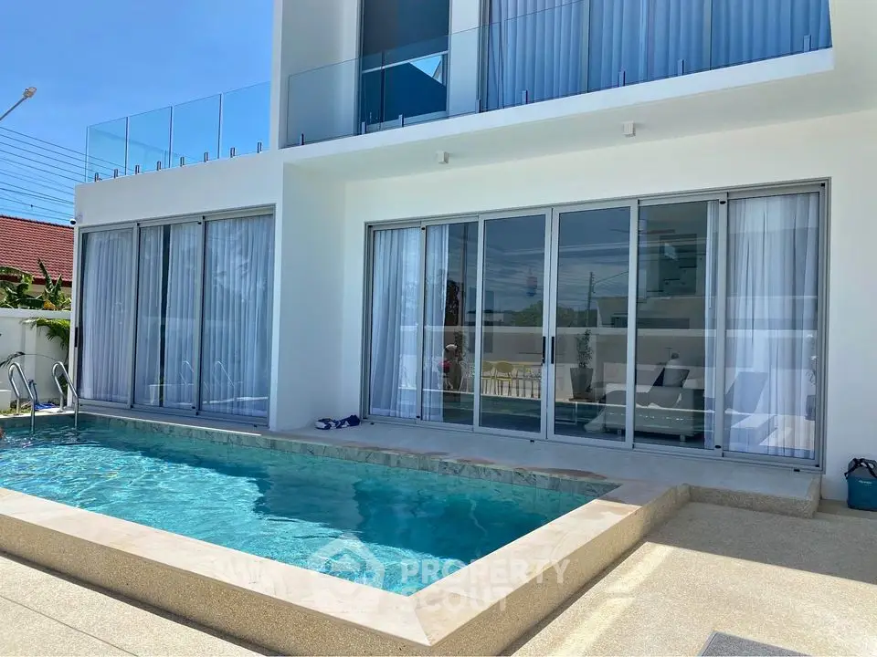 Modern luxury villa with private pool and glass balcony