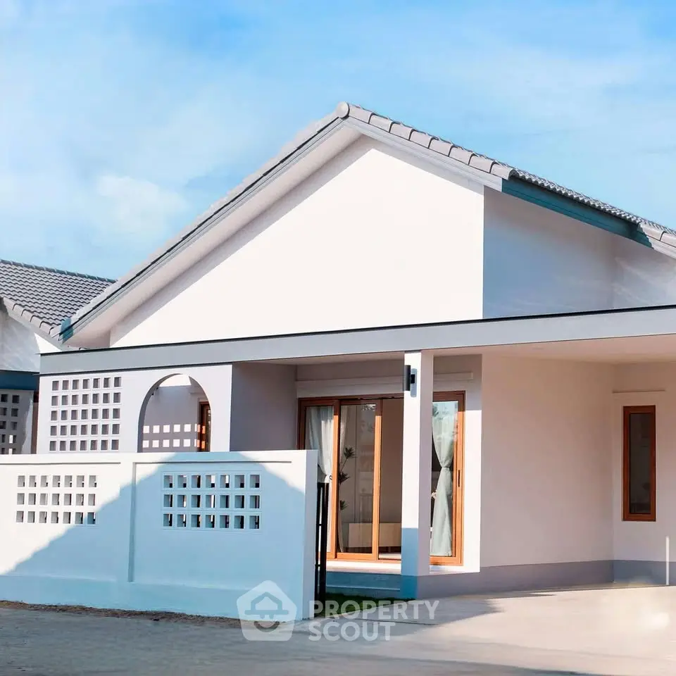 Modern single-story house with clean lines and large windows, perfect for family living.