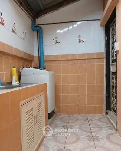 Cozy attic bedroom with sloped ceiling and wooden accents