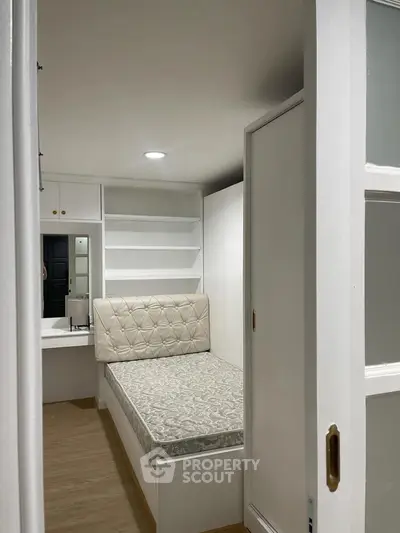 Cozy and compact bedroom with built-in storage and elegant design