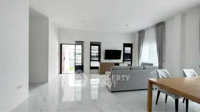 Spacious modern living room with sleek design and natural light