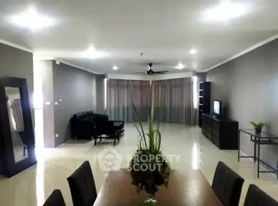 Spacious modern living room with elegant dining area and stylish decor