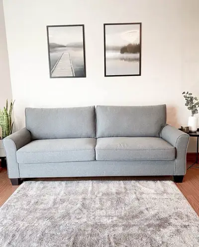 Stylish living room with modern gray sofa and elegant decor