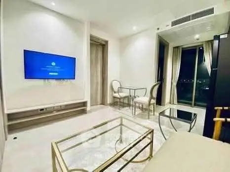 Modern living room with sleek furniture and city view, perfect for urban living.