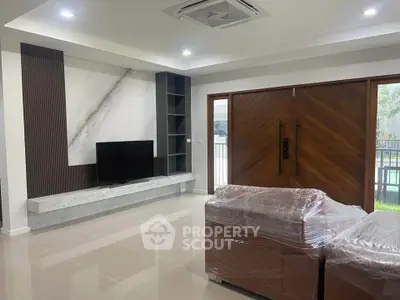 Modern living room with sleek TV setup and stylish furniture