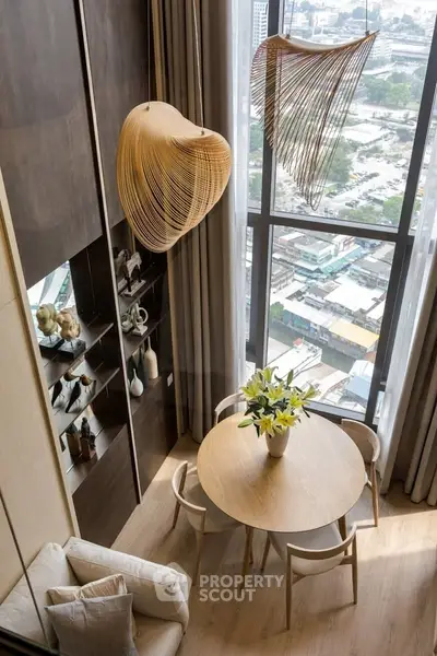 Stylish modern living room with high ceiling and city view