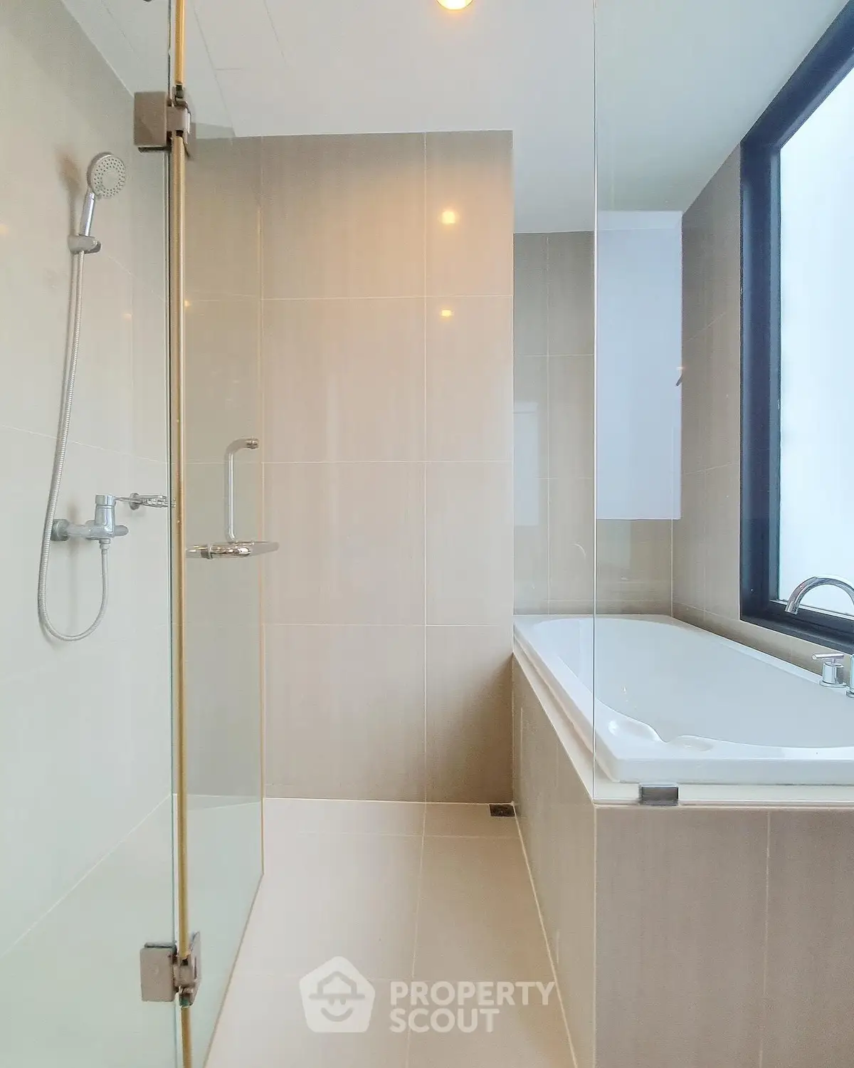 Modern bathroom with glass shower and large bathtub