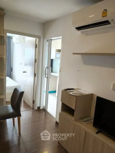 Modern apartment interior with air conditioning and sleek furniture, showcasing a cozy and functional living space.