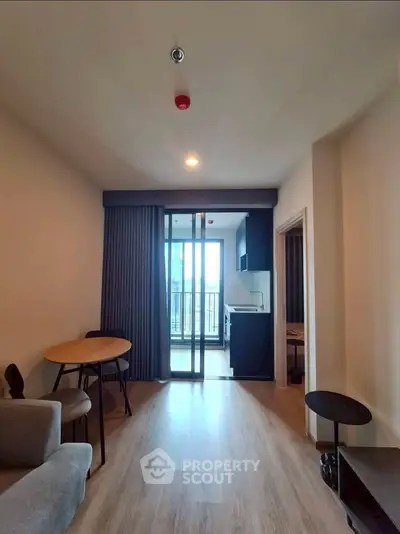 Modern apartment interior with open layout and balcony view