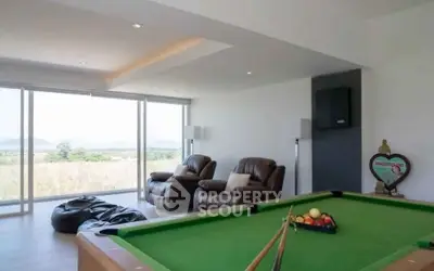 Spacious living room with pool table and panoramic views