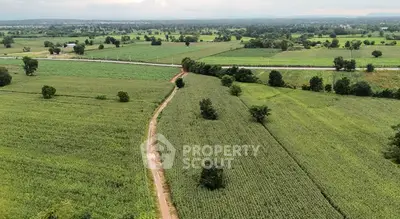 Expansive agricultural land with scenic views and lush greenery, perfect for farming or development.
