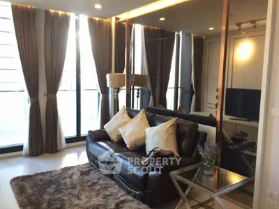 Luxurious living room with leather sofa, plush rug, and floor-to-ceiling windows for natural light.