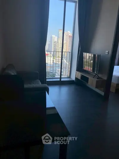 Modern living room with city view and sleek furniture, perfect for urban living.