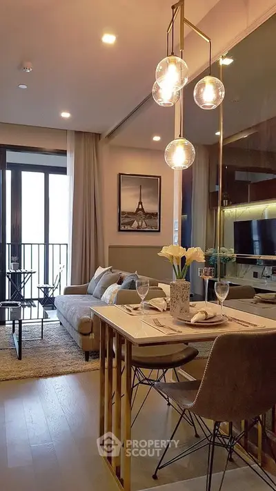 Stylish modern living room with dining area and balcony access in a chic apartment.