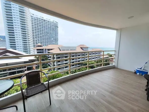 Spacious balcony with stunning city and ocean view, perfect for relaxation and entertaining.