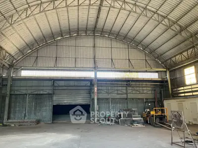 Spacious industrial warehouse with high ceilings and ample storage space