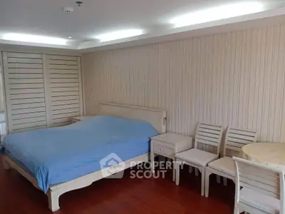Spacious bedroom with elegant wooden furniture and cozy ambiance