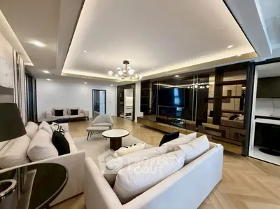 Luxurious modern living room with elegant lighting and spacious seating area.