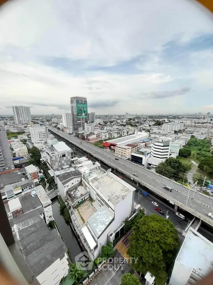Stunning cityscape view from high-rise building showcasing urban skyline and infrastructure.