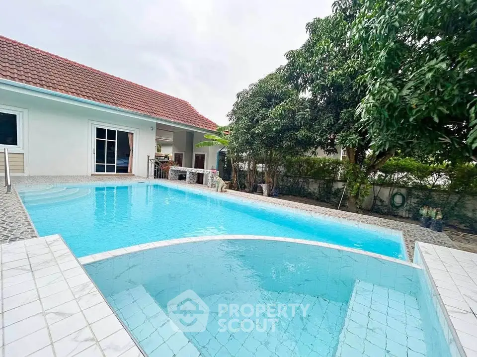Stunning villa with private pool and lush garden, perfect for luxurious living.