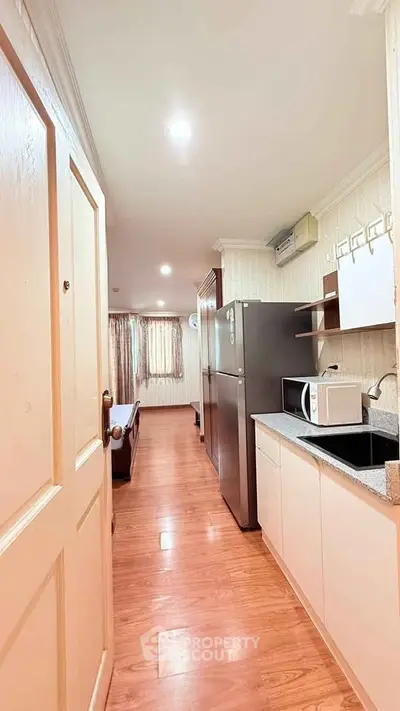 Charming apartment with modern kitchen and cozy living area, perfect for urban living.