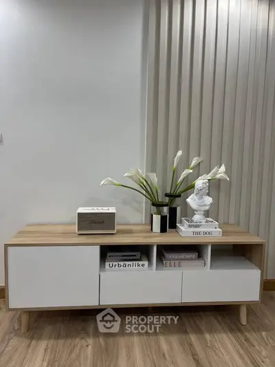 Stylish modern living room with elegant wooden console and decorative accents