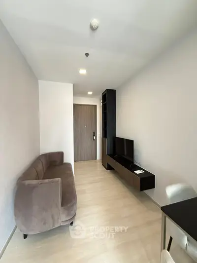 Modern living room with sleek furniture and neutral tones