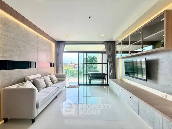 Spacious modern living room with large windows and stylish decor