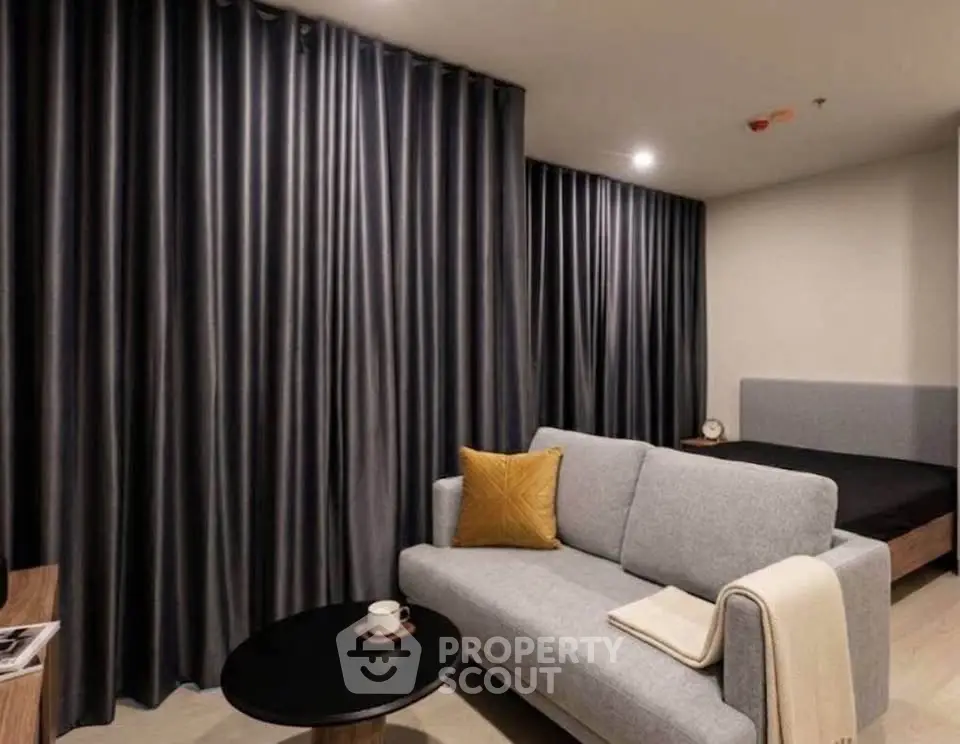 Modern studio apartment with cozy living area and stylish decor